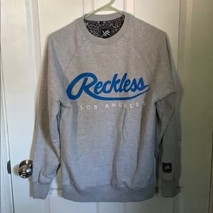 Young and reckless crewneck sweater